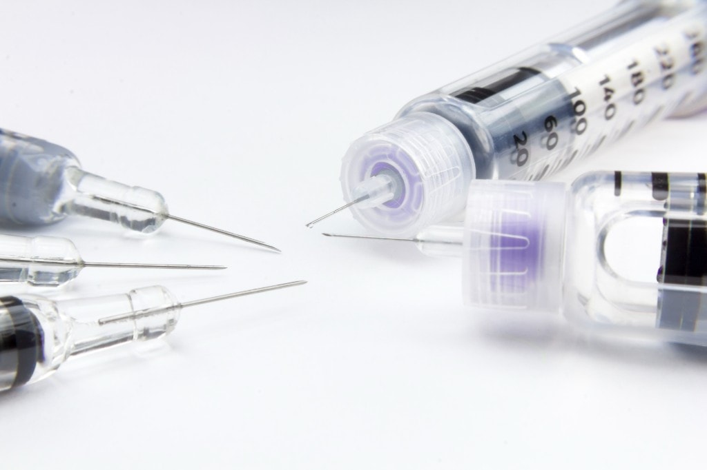 Precision device assembly of pharmaceutical syringes